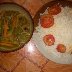 A picture of Beef gravy sauce with white rice.