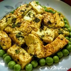 A picture of Kasuri Methi Paneer Curry With boiled Green Peas.