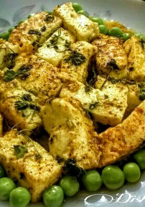 A picture of Kasuri Methi Paneer Curry With boiled Green Peas.