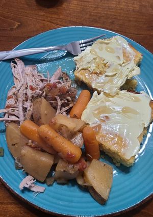 A picture of Slow cooked pork tenderloins with vegetables.