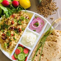 A picture of White Maash with white butter and roti.