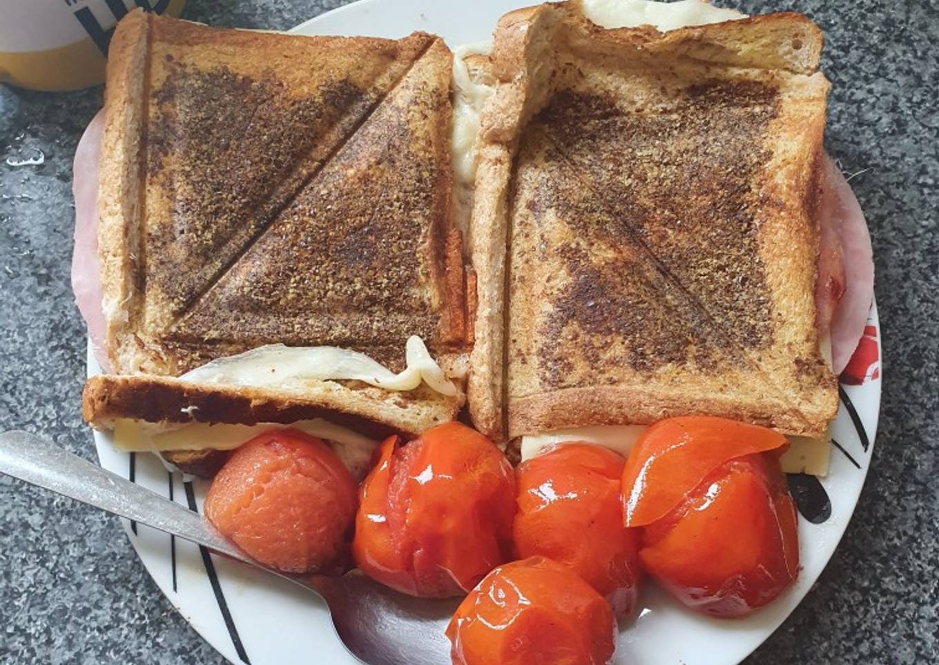 Two Cheese Ham Breville Toasties with whole fried Tomatoes