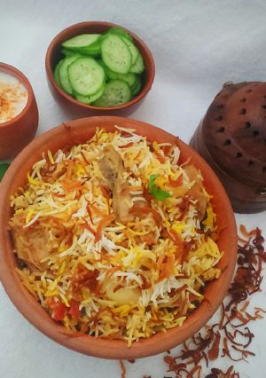 A picture of Chicken biryani with potatoes.