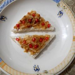 A picture of Bread with cream and fruit 🍞🍎🧈.