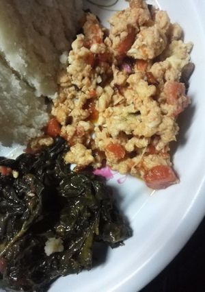 A picture of Fried kienyeji eggs served with green veges.