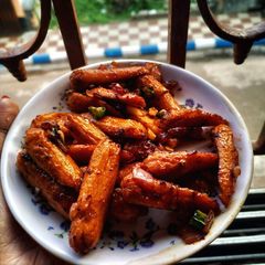 A picture of Chilli fried cocktail sausage.