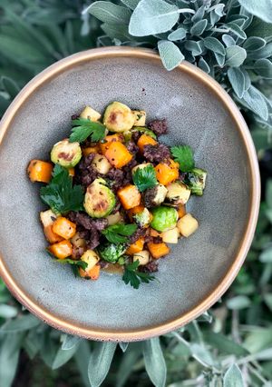 A picture of Wagyu Bratwurst and Butternut Squash Hash.