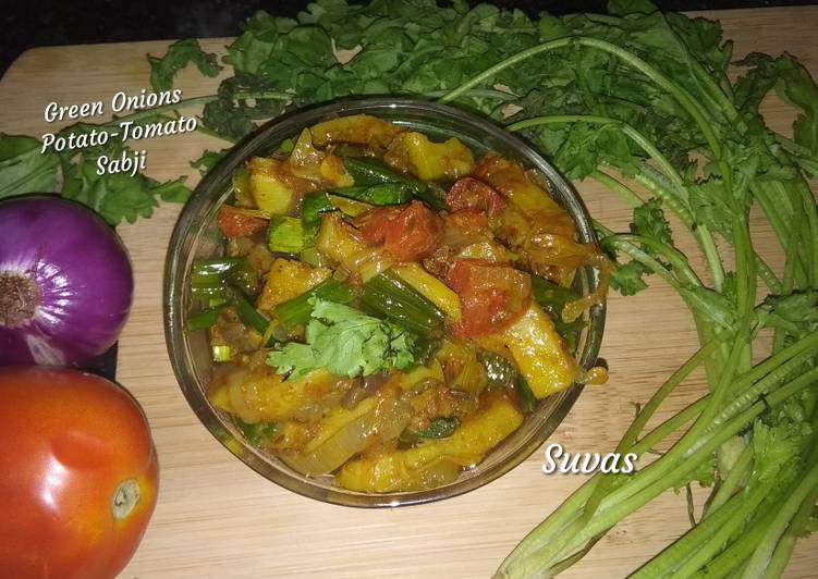 Steps to Prepare Super Quick Homemade Green Onions Potato Tomato Sabji