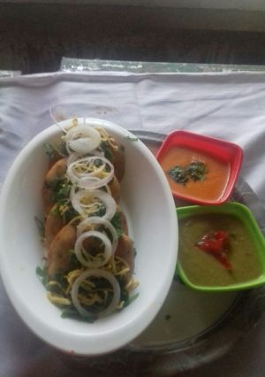 A picture of Suji Kachori with Red... Green... chutney.