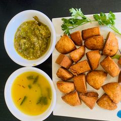 A picture of Daal Baati with Baigan Sabzi.