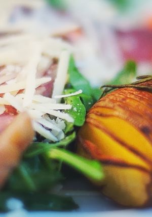 A picture of Tagliata beef on arugula.