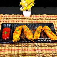 A picture of Tangy Besan-Stuffed Green Chilli Pakoras.