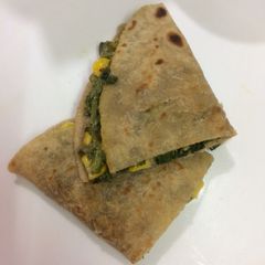 A picture of Mexican spinach corn and cheese quesadilla.