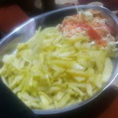 A picture of Fries and salad.