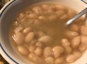 A picture of beans with smoked ham hocks