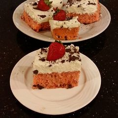 A picture of Fresh Strawberry Chip Cake with Lemon Cream Frosting.
