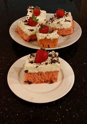 A picture of Fresh Strawberry Chip Cake with Lemon Cream Frosting.