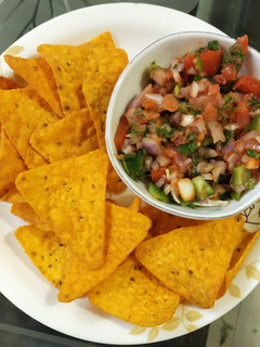 A picture of Nachos with Mexican Salsa.