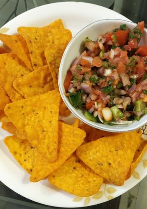 A picture of Nachos with Mexican Salsa.