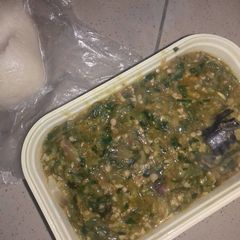 A picture of Okro soup with fresh titus fish.