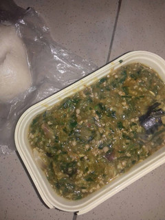 A picture of Okro soup with fresh titus fish.