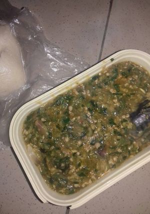 A picture of Okro soup with fresh titus fish.