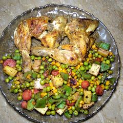 A picture of Chicken Tikka with mix veggies.