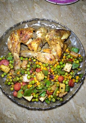 A picture of Chicken Tikka with mix veggies.