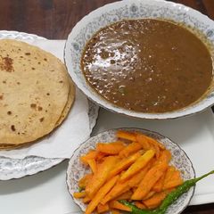 A picture of Sabat Maha(urad,Black lentils),Roti n Carrots.