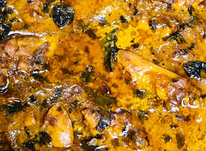 A picture of Peri peri chicken with gravy.