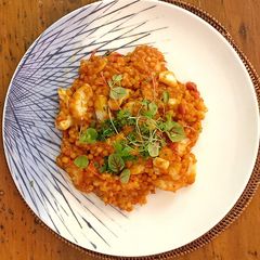 A picture of Fregola sarda with prawns, squid, scallops, blue eye cod and light tomato sauce.