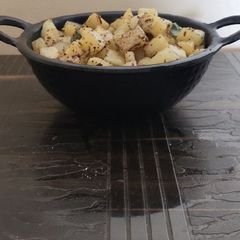 A picture of Potatoes with salt and pepper.