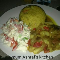 A picture of Jallop rice with stew and cosolow.