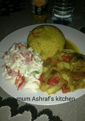 A picture of Jallop rice with stew and cosolow.