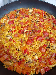 Una foto de Arroz meloso con calabaza y marisco