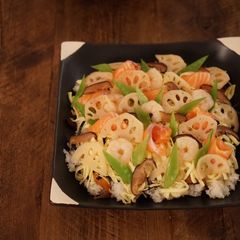 A picture of Chirashizushi (Scattered Sushi) with salmon and shrimp - Japanese sushi.