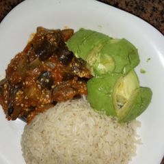 A picture of Rice eggplants curry and avocados #author marathon.