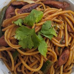 A picture of Mixed vegetables n sausage noodles.
