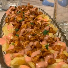 A picture of Dynamite loaded fries.
