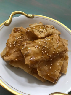 A picture of Fried Egg Roll Wraps with Syrup.