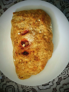 A picture of Ground Turkey Stuffed Calzone with garlic buttered crust.