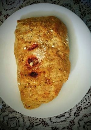 A picture of Ground Turkey Stuffed Calzone with garlic buttered crust.