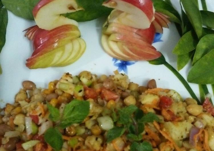 Chickpea fruits veggies and nuts salad