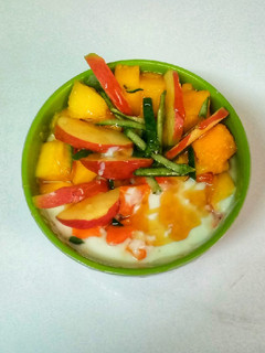 A picture of Tropical fruit salad with yoghurt.