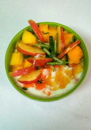 A picture of Tropical fruit salad with yoghurt.