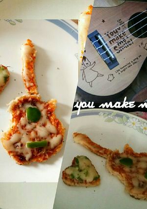 A picture of Bread guitar pizza.