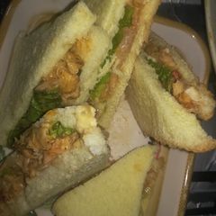A picture of Chicken veggi sandwich in pizza sauce.