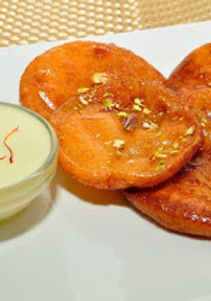 A picture of Malpua with Rabri.