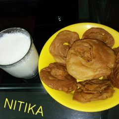 Sattpuda with hot milk A picture of Sattpuda with hot milk.