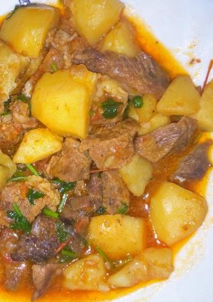 A picture of Stewed Beef served with Watu.